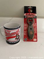 Mug beside packaged talking bottle opener