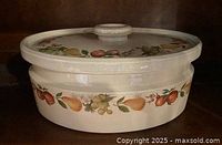 Lidded casserole showing Quince fruit decoration