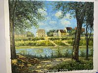 Full view of the oil painting showing a riverside village scene with trees in foreground.