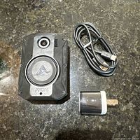 Camera front, USB cable, and USB block on countertop