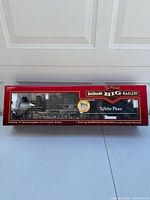 Front view of original red Bachmann Big Haulers box with window showing locomotive