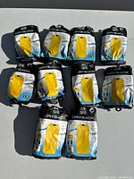 10 Granite Gear Drysack bags laid out flat on a surface, all in original packaging, yellow bags shown on front, some packages display sizing and features like waterproof, lightweight, factory seam sealed.