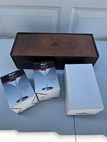 Wooden box with PlayStation logo and three boxes: two for Fanmara stainless steel martini glasses, one white box for a shaker cup.