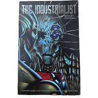 Front cover of THE INDUSTRIALIST graphic novel showing robotic figure with broken glass effect.