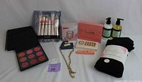 Lot of brand new beauty products and accessories including Morphe makeup palette, brush set, Luxe speaker, jewelry, hand care, and leggings.