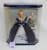 Front view of Special Edition Millennium Princess Barbie doll in original box, showcasing the doll in black and silver gown with tiara and necklace, and commemorative medallion included.