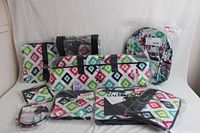 Front view of all organization items arranged showing colorful diamond pattern and floral backpack