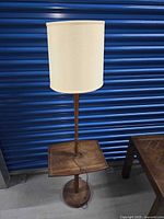 Full view of lamp showing shade, table, base, cord