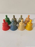 Front view of all eight coloured plastic bells