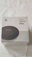 Front view of sealed Google Home Mini box