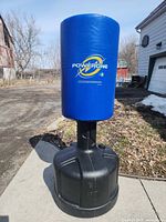 Front view of blue Powerline punching bag on black base