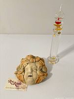 Plaque and thermometer side by side with Rue Royale tag