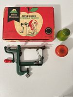 Apple parer corer slicer, original box, and two fruit shakers
