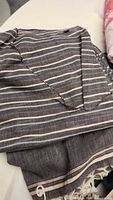 Close-up of dark gray striped Turkish spa coverup showing fabric texture and striped pattern