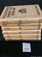 Stack of six Hardy Boy hardcover books showing worn spines and minor damage.