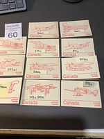 Photo showing 12 postal stationery items with red airplane illustrations, some annotated with 'Error' and '593x1'