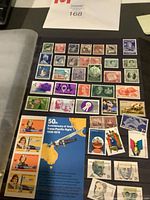 Photo showing arranged Australian postage stamps including themed blocks and commemorative panels from mid 20th century.