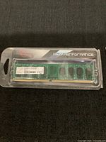 Photo of G.SKILL DDR2 2GB desktop RAM module inside clear plastic packaging labeled 'High Performance'. Shows memory chips and label.