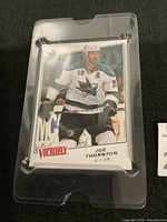 Front of Joe Thornton 2008-09 Upper Deck Victory oversized hockey card in plastic sleeve showing player in San Jose Sharks uniform.