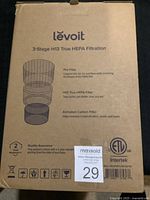 Front box side showing Levoit brand, 3-stage H13 True HEPA filtration details including Pre-Filter, H13 True HEPA Filter, and Activated Carbon Filter, along with warranty and certifications.