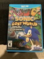 Front cover of Sonic Lost World Deadly Six Bonus Edition game case showing Sonic and characters with Wii U branding.