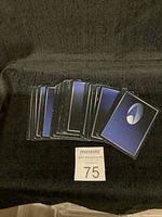 Lots of Star Trek CCG cards stacked, showing blue backs with Star Trek emblem