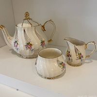 Full set of Sadler teapot, creamer, and sugar bowl showcasing design and condition