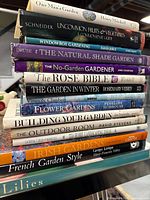 Stack of 15 gardening books showing titles and authors on spines