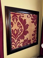 Square cork pin board with decorative damask fabric inset, framed by a dark wood frame