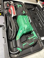 Metabo CR 13VST reciprocating saw with power cord inside black carrying case.
