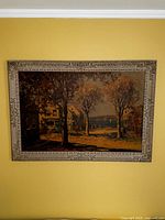 Vintage style framed seaside street scene artwork on canvas mounted on wood, showing trees, houses, and sailboats in the distance.