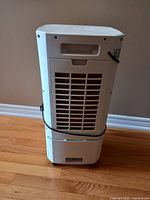 Rear view showing carrying handle and back vent panel.