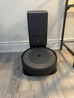 Robot vacuum and charging base positioned on floor