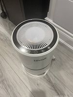 Front top view showing top vent and control buttons including power and speed settings.