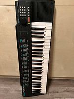 Top view of the Yamaha PSR-75 keyboard showing keys, buttons, and control panel.