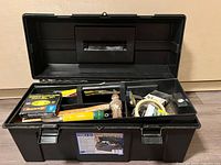 Open black toolbox with tools inside