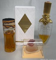 Lot showing three perfume items including two Boucheron bottles and Fiorilu decorative perfume by Pupa in case
