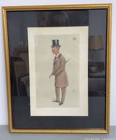 Full view of framed lithograph showing Earl Dunraven in formal attire with a gold frame.
