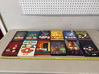 All 12 South Park DVD box sets laid out on a table showing their cover art.