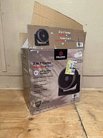 Box of Pelonis 2 in 1 Turbo Heater and Fan, showing front and top with branding and usage visuals.