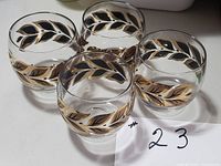 Four of the six roly poly glasses showing laurel leaf pattern