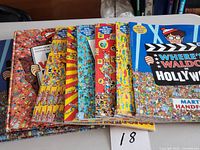 Stack of seven Where's Waldo hardcover books showing spines and covers