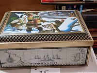 Top view showing artwork and lattice border of Hudson’s Bay tin