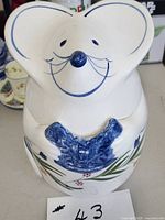 Full view of ceramic mouse cookie jar with lid in place