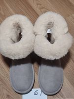 Top view of both boots showing suede exterior and sheepskin lining