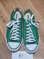 Top view of both sneakers showing uppers, laces, toe caps