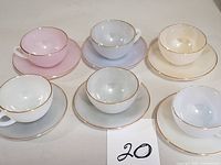 Six pastel Arcopal cups with matching saucers