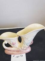 Front view of Hull double cornucopia vase showing floral relief and matte finish