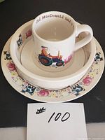 Entire three-piece set stacked showing mug, bowl, plate