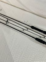 Close-up view of the rods focusing on the grips and guide rings to display quality and condition.